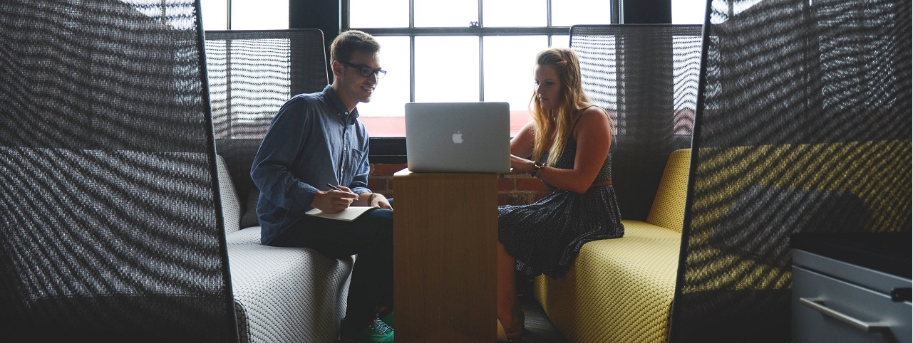 two people working together